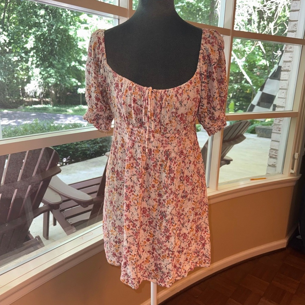 Lush floral dress features a square neckline and smocked waist size M